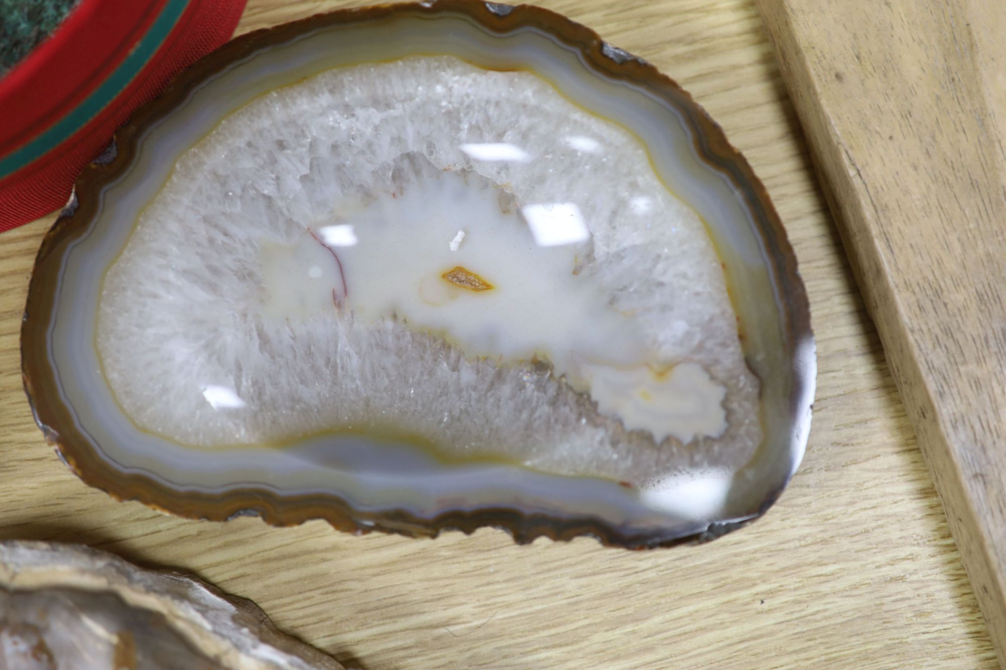 An amethyst geode section and assorted mineral specimens